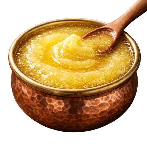 Golden ghee served in a copper bowl